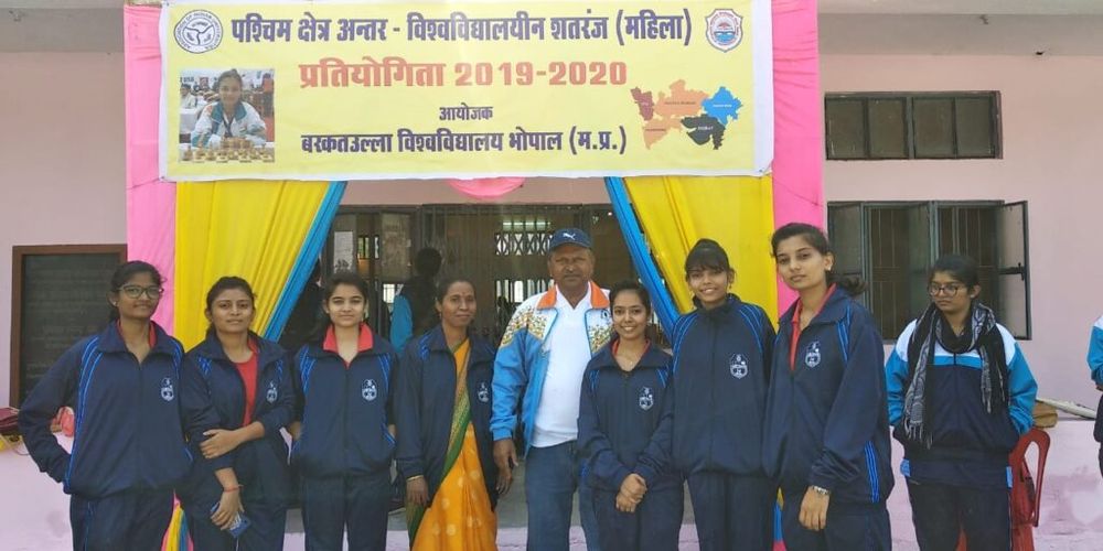 Student sports team with trophies at an inter-collegiate sports event